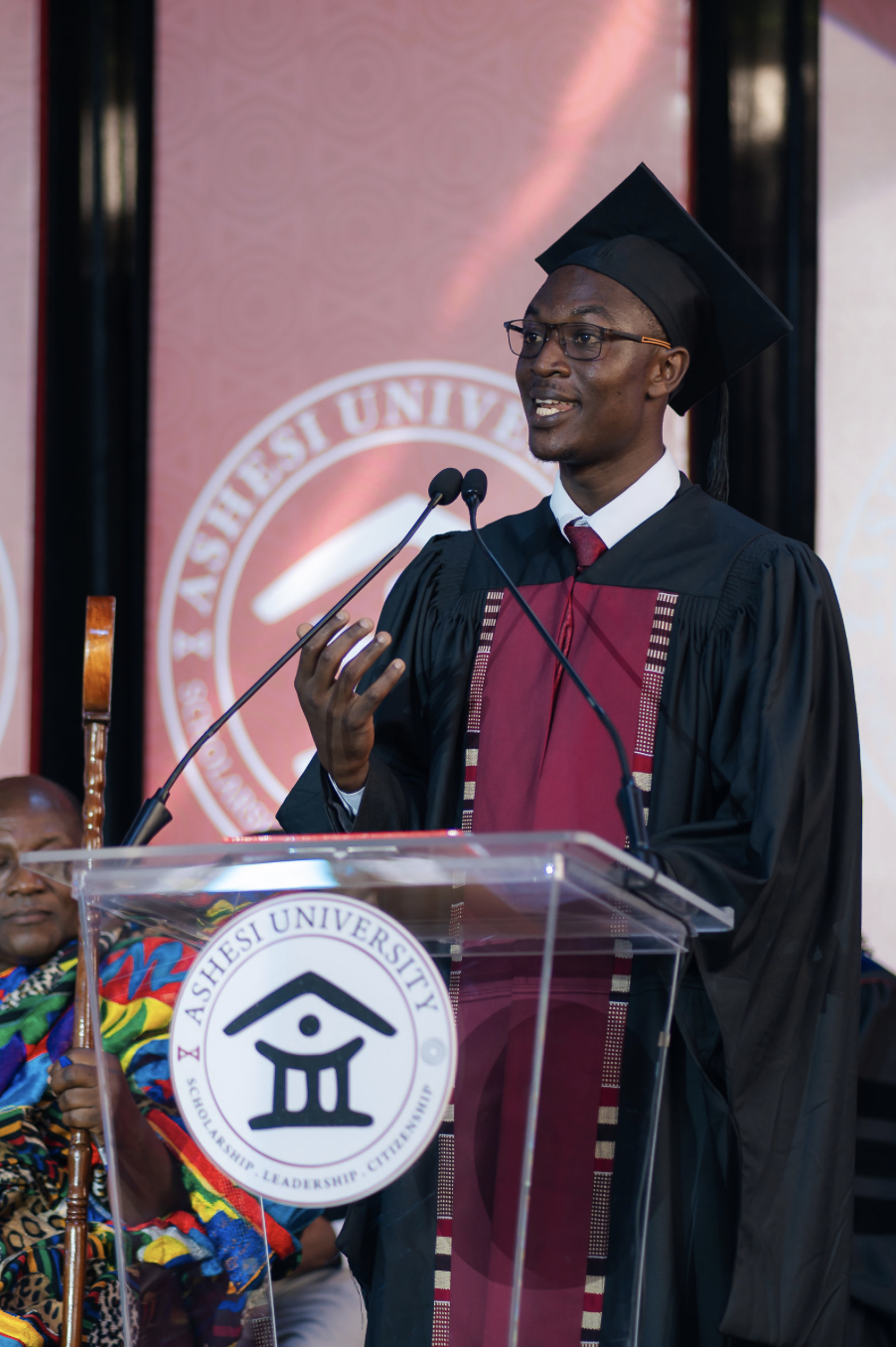 Timothy stands at the podium