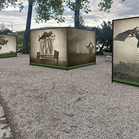 Black and white images displayed on large cubes outside