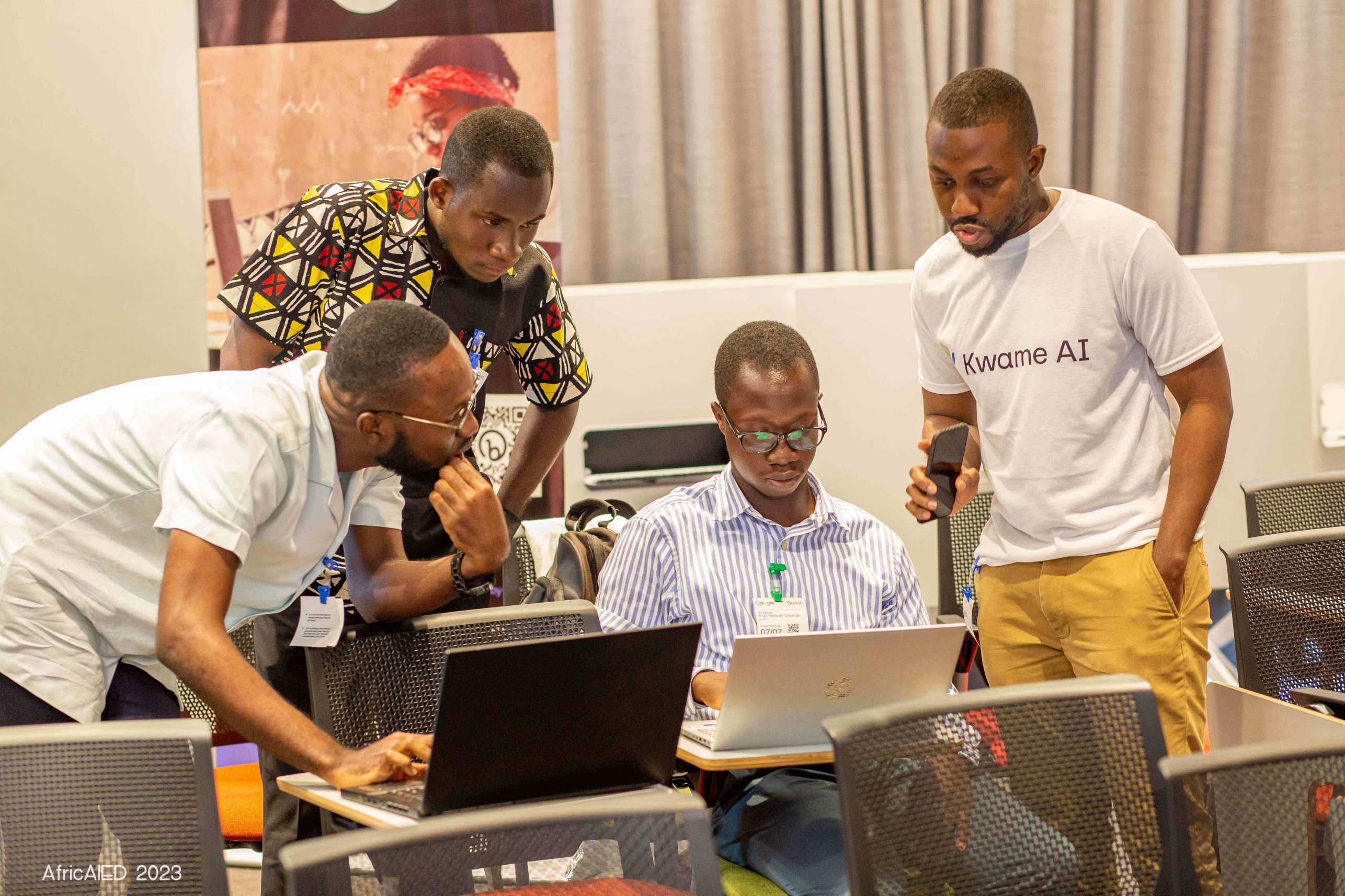 men around a computer